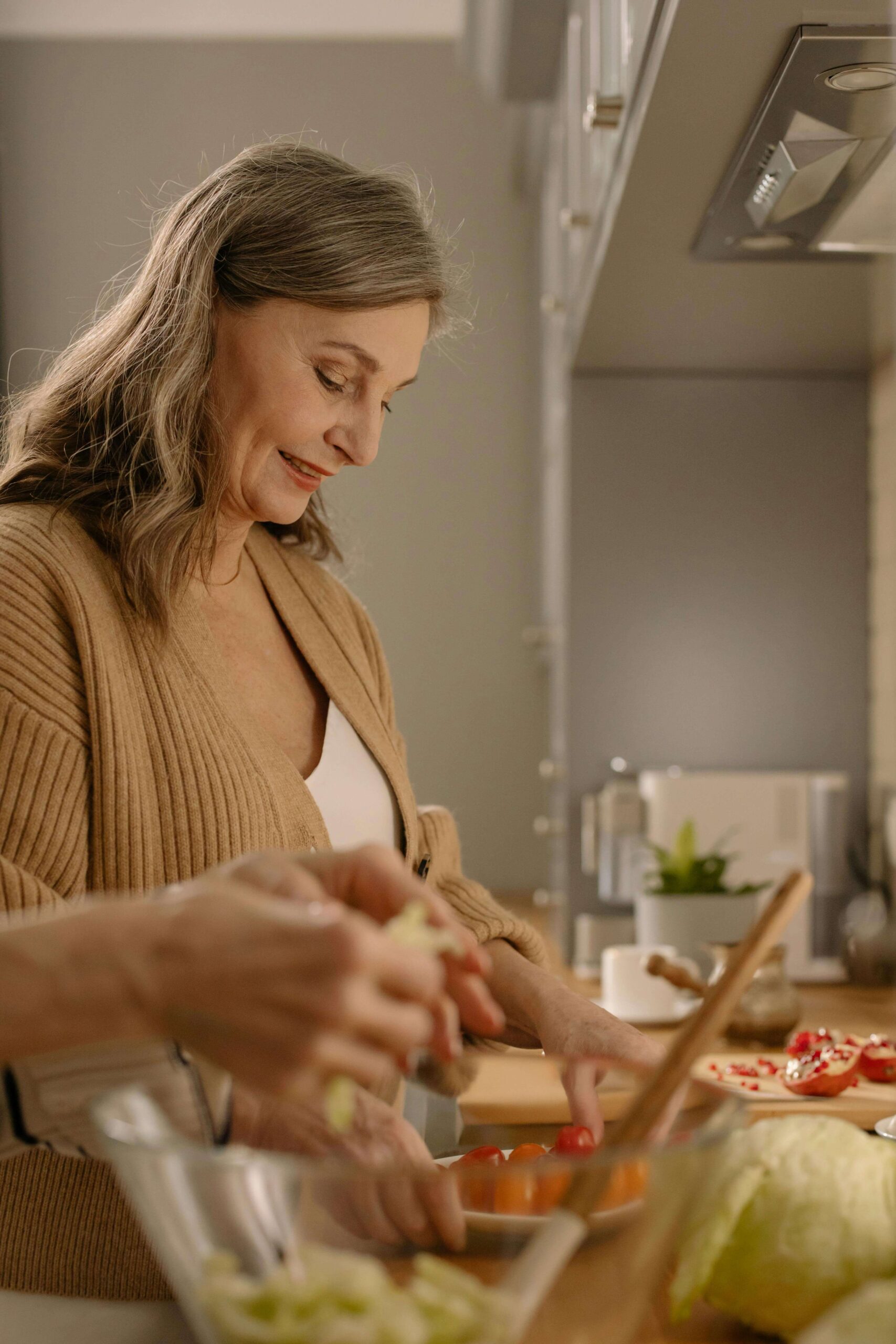 The image shows an older lady cooking healthy food